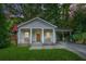 Charming craftsman home with a covered front porch and a convenient carport at 727 Holmes Nw St, Atlanta, GA 30318