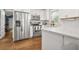 Modern kitchen with stainless steel appliances, white cabinets, and marble countertops at 727 Holmes Nw St, Atlanta, GA 30318