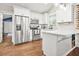 Modern kitchen featuring stainless steel appliances, white cabinetry, and a stylish breakfast bar at 727 Holmes Nw St, Atlanta, GA 30318