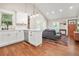 Open concept living space with wood floors, modern lighting, and vaulted ceilings at 727 Holmes Nw St, Atlanta, GA 30318