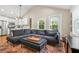 Comfortable living room featuring vaulted ceiling and seamless flow into a modern kitchen at 727 Holmes Nw St, Atlanta, GA 30318