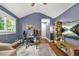 Angled view of home office, with hardwood floors, ceiling fan, and plenty of room at 727 Holmes Nw St, Atlanta, GA 30318
