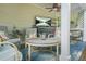 Relaxing outdoor patio with comfortable seating, ceiling fan, and mounted television at 727 Holmes Nw St, Atlanta, GA 30318