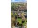 Desirable lakefront property featuring a sprawling lawn and manicured landscaping at 1525 Lockridge Dr, Cumming, GA 30041