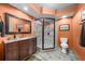 Elegant bathroom featuring granite countertops, a glass-enclosed shower, and a classic tile floor at 1525 Lockridge Dr, Cumming, GA 30041