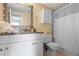 Clean bathroom featuring a vanity, granite countertop, and shower with updated fixtures at 199 14Th Street Ne St # 2501, Atlanta, GA 30309