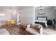 Open concept living area featuring a bedroom with a comfortable bed, desk, and a view to the bathroom at 199 14Th Street Ne St # 2501, Atlanta, GA 30309