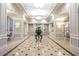 Luxurious lobby with decorative lights, an elegant floral display, marble tile flooring, and detailed wall molding at 199 14Th Street Ne St # 2501, Atlanta, GA 30309