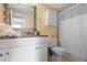 Well-maintained bathroom with granite countertop and white vanity, providing a clean and functional space at 199 14Th Street Northeast Ne St # 2501, Atlanta, GA 30309