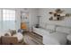 Sunlit living room boasts sliding doors, comfortable seating, and stylish shelving at 199 14Th Street Northeast Ne St # 2501, Atlanta, GA 30309