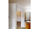 Bathroom with granite counters, light wood cabinets, and a walk-in closet at 2320 Polaris Sw Way, Atlanta, GA 30331