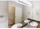 Bright bathroom featuring double sinks, granite counters, and a large mirror with vanity lighting at 2320 Polaris Sw Way, Atlanta, GA 30331