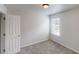Bright bedroom featuring a window and closet space at 2320 Polaris Sw Way, Atlanta, GA 30331