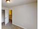 Carpeted bedroom with door leading to hallway at 2320 Polaris Sw Way, Atlanta, GA 30331