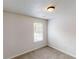 Cozy bedroom with a window, carpeted floor, and neutral color scheme at 2320 Polaris Sw Way, Atlanta, GA 30331