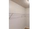 Simple walk-in closet equipped with a white wire shelf for organization at 2320 Polaris Sw Way, Atlanta, GA 30331