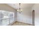 Bright dining area with wainscoting, chandelier, and natural light at 2320 Polaris Sw Way, Atlanta, GA 30331