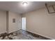 Unfinished garage view, showing a door to the home's interior at 2320 Polaris Sw Way, Atlanta, GA 30331