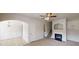 Open floor plan with living and dining areas, fireplace, and neutral tones at 2320 Polaris Sw Way, Atlanta, GA 30331