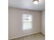Bedroom featuring neutral walls, carpet and window with blinds, creating a calming and bright atmosphere at 3136 Palomino Dr, Powder Springs, GA 30127
