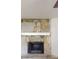 Close-up of the stone fireplace with a wooden mantle, adding rustic charm at 3136 Palomino Dr, Powder Springs, GA 30127