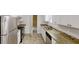 Modern kitchen with stainless steel appliances, granite countertops, and ample cabinet space at 3136 Palomino Dr, Powder Springs, GA 30127