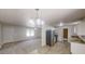 Open-concept living room with a dining area, stainless steel appliances, and abundant natural light at 3136 Palomino Dr, Powder Springs, GA 30127