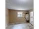 Unfinished room with a window and access to the kitchen, waiting to be personalized at 3136 Palomino Dr, Powder Springs, GA 30127