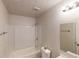 Bright bathroom featuring a tub, toilet, sink, and vanity lighting at 3457 Newberry Trl, Decatur, GA 30034
