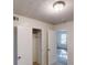 Bedroom featuring closet space, doors to the bathroom and hallway, and neutral carpet at 3457 Newberry Trl, Decatur, GA 30034