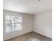 Bedroom featuring neutral walls, plush carpeting, and a window with blinds at 3457 Newberry Trl, Decatur, GA 30034