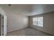 Bedroom with neutral carpeting, a window with blinds, and a closet door at 3457 Newberry Trl, Decatur, GA 30034