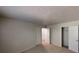 Bedroom with plush carpeting, closet with open doors, and neutral colored walls at 3457 Newberry Trl, Decatur, GA 30034