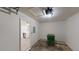 Attached garage with a view of the kitchen, a trash can, and room for storage at 3457 Newberry Trl, Decatur, GA 30034