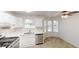 Well-lit kitchen with modern appliances, white countertops, and a breakfast nook at 3457 Newberry Trl, Decatur, GA 30034