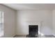 A close up of the living room featuring a black fireplace and large window at 3457 Newberry Trl, Decatur, GA 30034