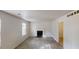 Bright living room featuring gray floors, a fireplace, and a window for natural light at 3457 Newberry Trl, Decatur, GA 30034