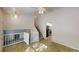 Open-concept living room with stairs, tile floors, and connection to the kitchen at 3457 Newberry Trl, Decatur, GA 30034