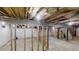 Unfinished basement featuring exposed ceiling with visible insulation and wood frame construction at 3695 Fox Hills Se Dr, Marietta, GA 30067