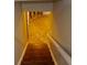 Basement stairwell featuring white walls, a white banister and stairs to the left at 3695 Fox Hills Se Dr, Marietta, GA 30067
