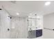 Modern bathroom with a glass shower and double sink vanity with lighting at 3695 Fox Hills Se Dr, Marietta, GA 30067