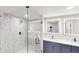 This bathroom features a sleek, glass-enclosed shower and double vanity at 3695 Fox Hills Se Dr, Marietta, GA 30067