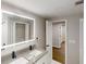 This bathroom boasts a large, lighted mirror above a double sink vanity at 3695 Fox Hills Se Dr, Marietta, GA 30067