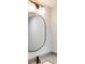 Modern bathroom features an oval mirror, sleek faucet, and contemporary lighting at 3695 Fox Hills Se Dr, Marietta, GA 30067