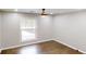 Bedroom with hardwood floors, a modern ceiling fan, and a window with natural light at 3695 Fox Hills Se Dr, Marietta, GA 30067