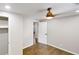 Bedroom with hardwood floors, ceiling fan and closet nearby the entry door at 3695 Fox Hills Se Dr, Marietta, GA 30067