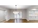 Dining room features hardwood floors and white French doors, creating a light filled space at 3695 Fox Hills Se Dr, Marietta, GA 30067
