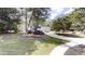Traditional two-story home boasts well-manicured lawn, landscaping and long driveway at 3695 Fox Hills Se Dr, Marietta, GA 30067