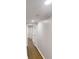 Hallway with wood floors and white trim with view to other rooms at 3695 Fox Hills Se Dr, Marietta, GA 30067