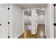 Hallway showcasing beautiful hardwood floors and modern doorways at 3695 Fox Hills Se Dr, Marietta, GA 30067